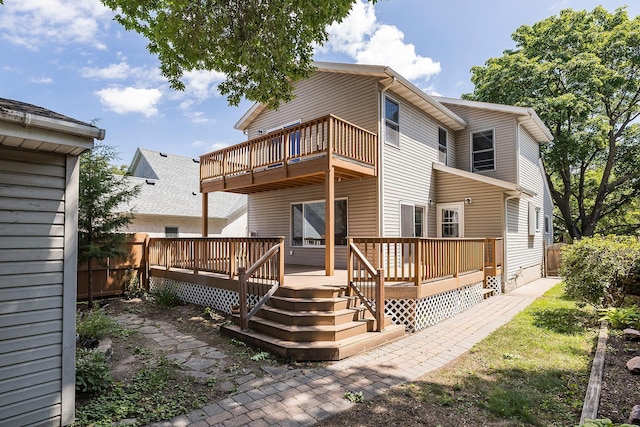 4716 30th Ave S, Minneapolis, MN 55406 - rear view of house featuring a balcony and a wooden deck