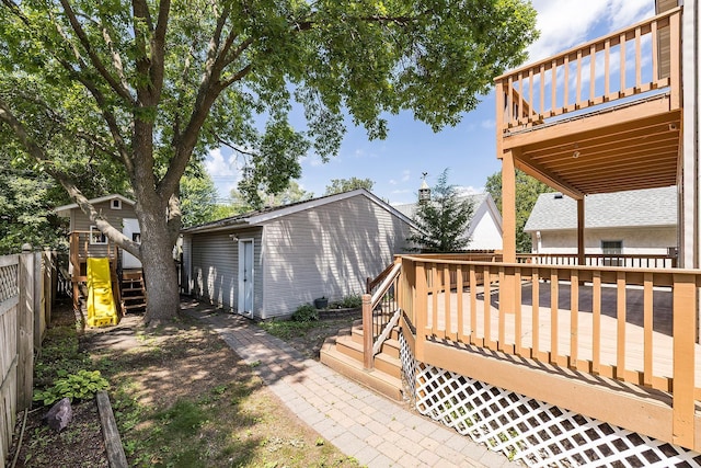 4716 30th Ave S, Minneapolis, MN 55406 - view of yard featuring a deck and an outdoor structure