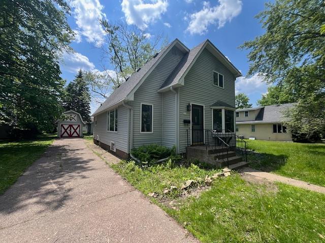 241 S Street W, Amery, WI 54001 - view of front of property with a front yard and a storage unit
