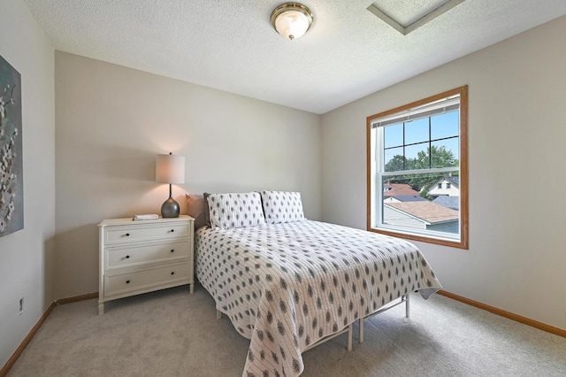 927 Charles Ave, Saint Paul, MN 55104 - bedroom with attic access, carpet, and a textured ceiling