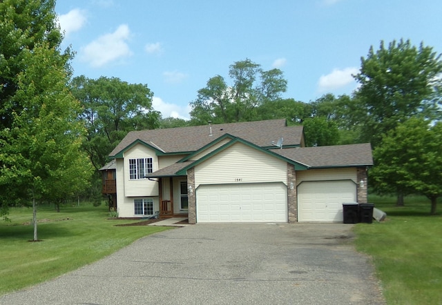 1541 282nd Ln NW, Isanti Twp, MN 55040 - split level home with driveway, a garage, a front yard, brick siding, and roof with shingles