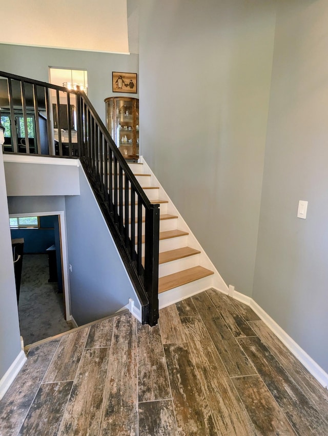 1541 282nd Ln NW, Isanti Twp, MN 55040 - stairs featuring wood finished floors and a chandelier