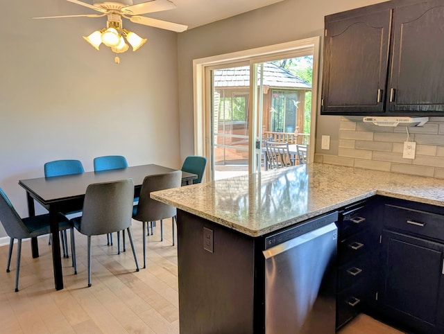 1541 282nd Ln NW, Isanti Twp, MN 55040 - kitchen with dishwasher, backsplash, ceiling fan, a peninsula, and light stone countertops