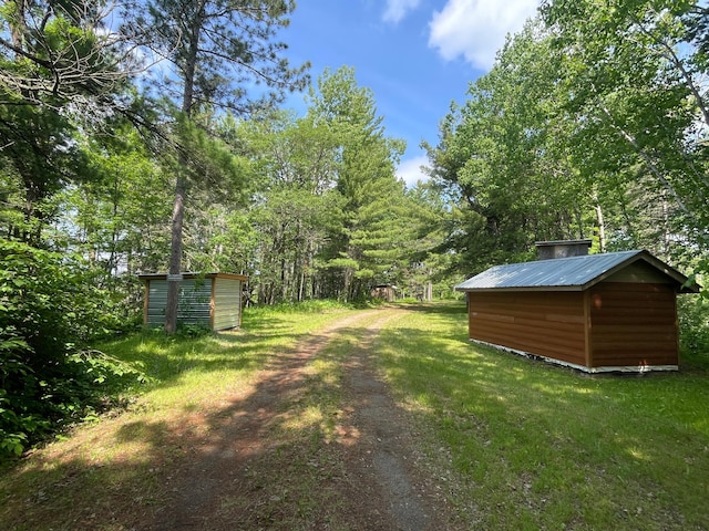31519 243rd Ave, Moose Creek Twp, MN 56676 - view of green lawn featuring a storage shed
