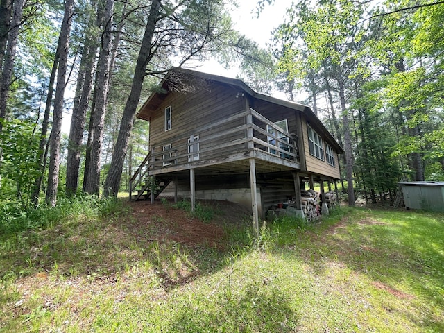 31519 243rd Ave, Moose Creek Twp, MN 56676 - back of property featuring a wooden deck and stairway