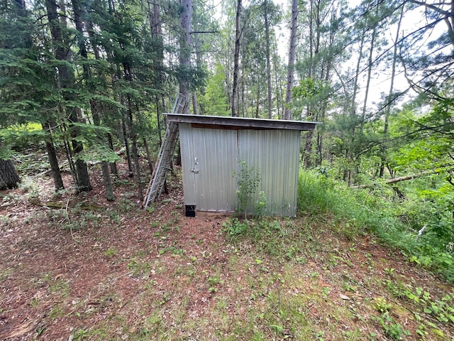 31519 243rd Ave, Moose Creek Twp, MN 56676 - view of shed with a wooded view