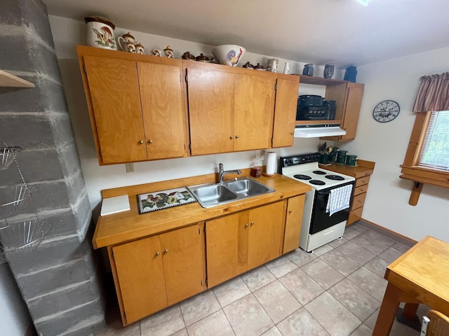 31519 243rd Ave, Moose Creek Twp, MN 56676 - kitchen featuring white range with electric stovetop, under cabinet range hood, light tile patterned floors, and light countertops
