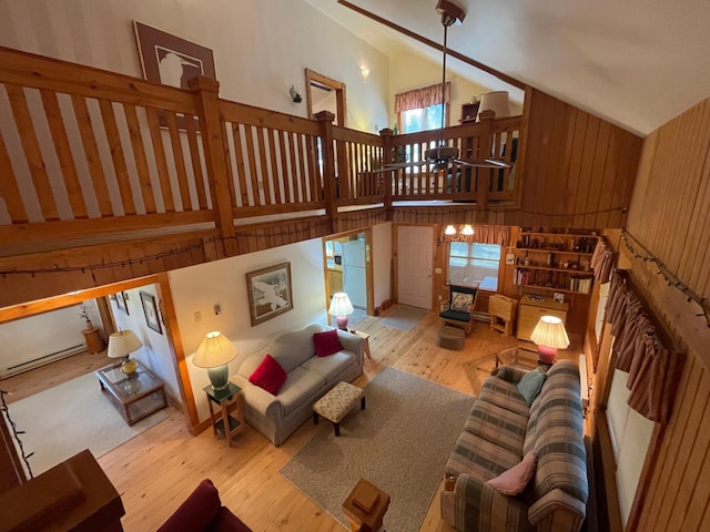 31519 243rd Ave, Moose Creek Twp, MN 56676 - living room featuring high vaulted ceiling, hardwood / wood-style floors, and a chandelier