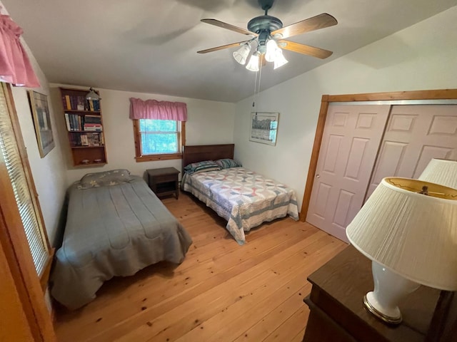 31519 243rd Ave, Moose Creek Twp, MN 56676 - bedroom with lofted ceiling, light wood-style floors, a closet, and a ceiling fan