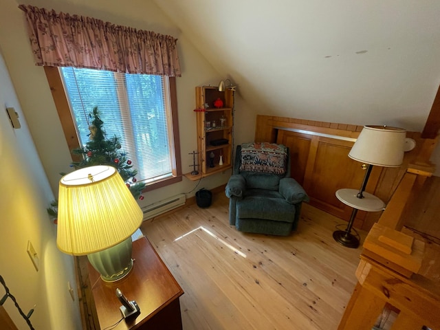 31519 243rd Ave, Moose Creek Twp, MN 56676 - sitting room with a baseboard heating unit, vaulted ceiling, and light wood finished floors