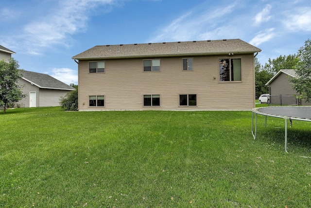 617 Knights Ct, Sartell, MN 56377 - back of property featuring a trampoline and a lawn