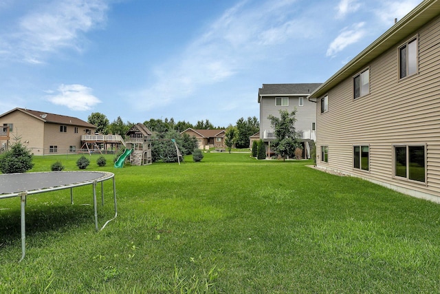 617 Knights Ct, Sartell, MN 56377 - view of grassy yard with a trampoline, a playground, and a residential view