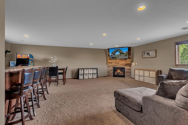 617 Knights Ct, Sartell, MN 56377 - living room with carpet floors, a stone fireplace, and recessed lighting