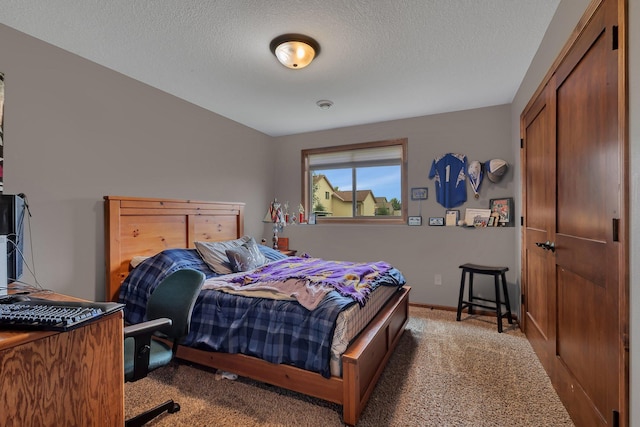 617 Knights Ct, Sartell, MN 56377 - carpeted bedroom featuring a textured ceiling and baseboards