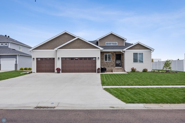 2548 Golden Valley Pkwy S, Fargo, ND 58104 - craftsman-style house featuring an attached garage, concrete driveway, and brick siding