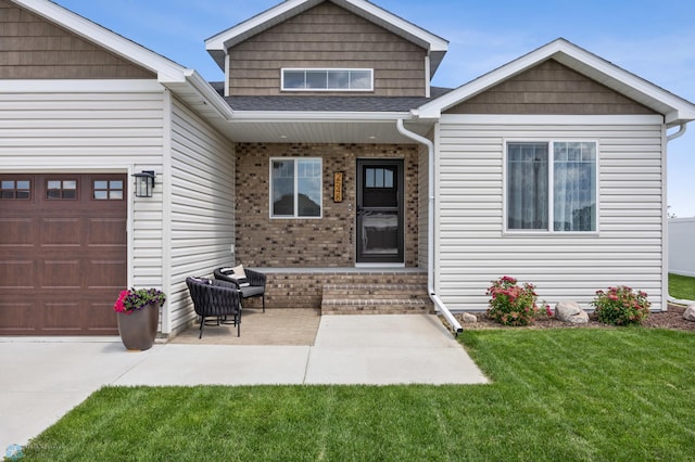 2548 Golden Valley Pkwy S, Fargo, ND 58104 - view of front facade with a garage, a front lawn, brick siding, and a shingled roof