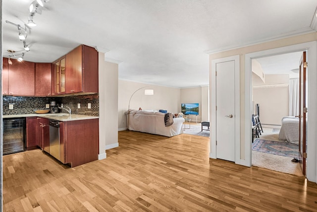 2800 44th St Unit 608, Minneapolis, MN 55410 - kitchen with beverage cooler, stainless steel dishwasher, light countertops, light wood-style floors, and open floor plan