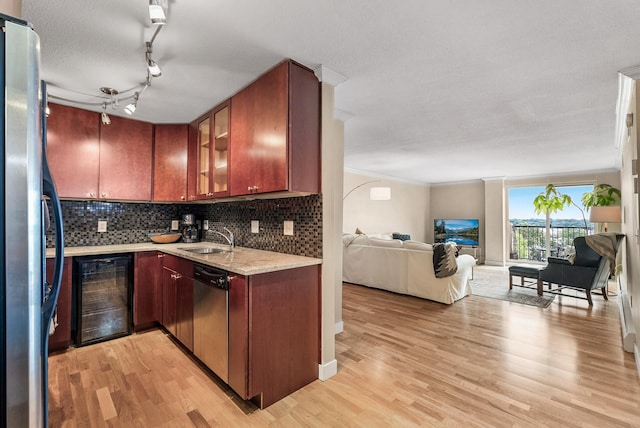 2800 44th St Unit 608, Minneapolis, MN 55410 - kitchen featuring beverage cooler, dishwasher, open floor plan, freestanding refrigerator, and light wood-type flooring