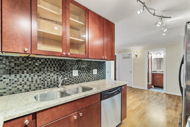 2800 44th St Unit 608, Minneapolis, MN 55410 - kitchen with stainless steel dishwasher, light wood-type flooring, decorative backsplash, fridge, and crown molding