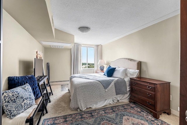 2800 44th St Unit 608, Minneapolis, MN 55410 - bedroom with light carpet, a textured ceiling, a baseboard heating unit, and crown molding
