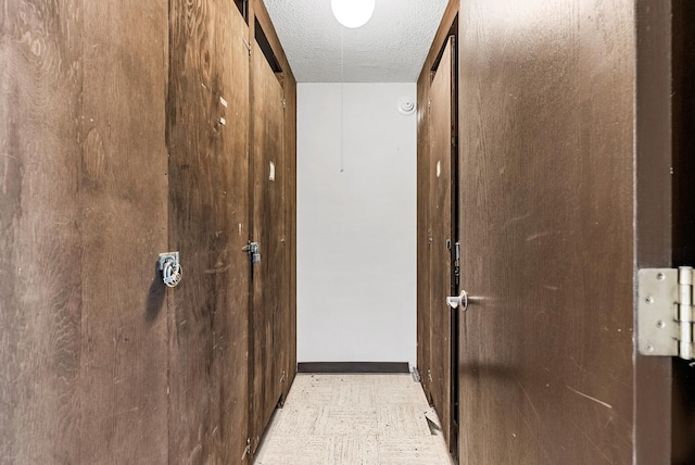 2800 44th St Unit 608, Minneapolis, MN 55410 - corridor with a textured ceiling and baseboards