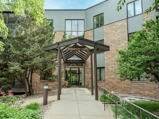 10 Windsor Ct Unit 205, New Brighton, MN 55112 - entrance to property featuring brick siding and stucco siding