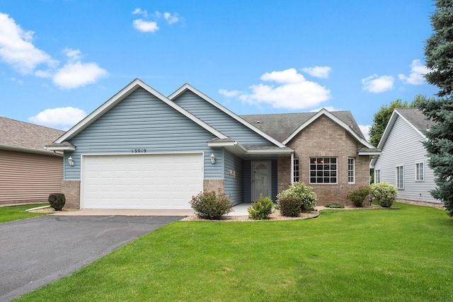 13019 Brookside Ln N, Rogers, MN 55374 - view of front of house featuring brick siding, a front yard, asphalt driveway, an attached garage, and a shingled roof
