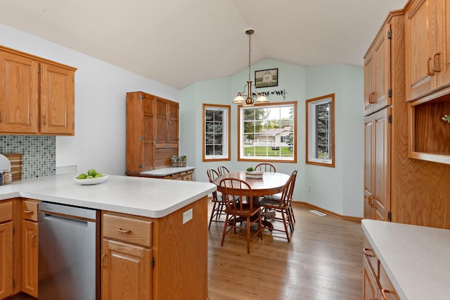 13019 Brookside Ln N, Rogers, MN 55374 - kitchen with dishwasher, a peninsula, light wood-type flooring, light countertops, and tasteful backsplash