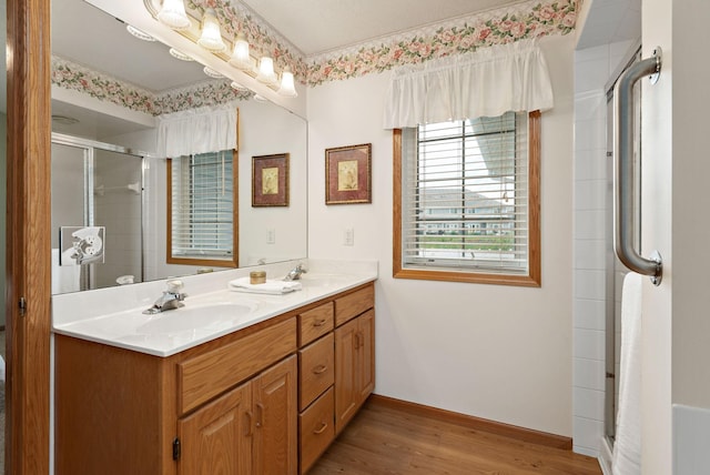 13019 Brookside Ln N, Rogers, MN 55374 - bathroom with a shower stall, double vanity, and wood finished floors