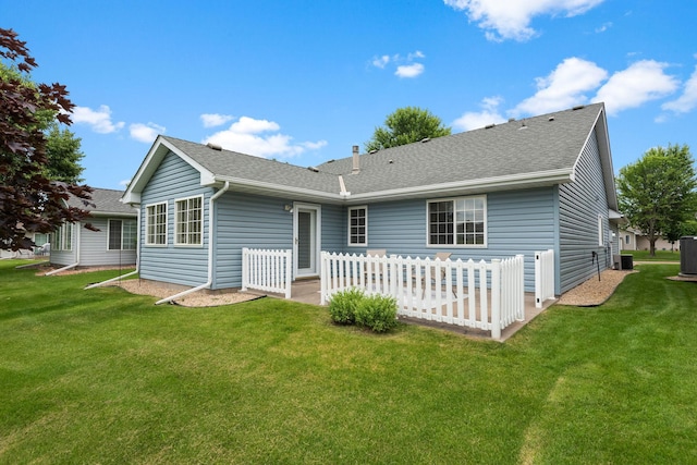13019 Brookside Ln N, Rogers, MN 55374 - rear view of property featuring a yard and a shingled roof