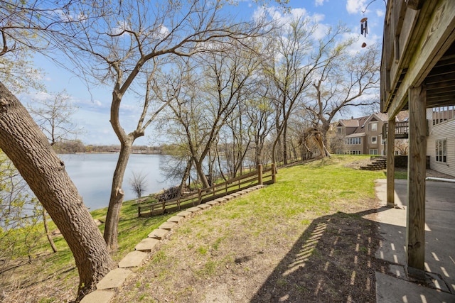 1181 12th Ave NW, New Brighton, MN 55112 - view of yard featuring a water view and a patio area