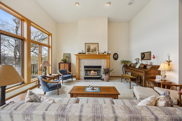 1181 12th Ave NW, New Brighton, MN 55112 - carpeted living room with a tiled fireplace, recessed lighting, and a towering ceiling