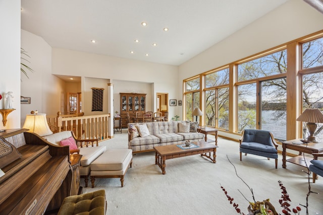 1181 12th Ave NW, New Brighton, MN 55112 - carpeted living room featuring recessed lighting, a high ceiling, and a water view