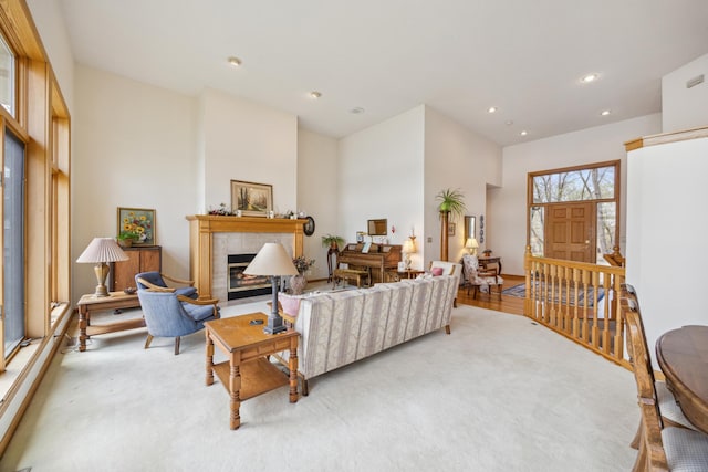 1181 12th Ave NW, New Brighton, MN 55112 - living room featuring a tiled fireplace, recessed lighting, and a towering ceiling
