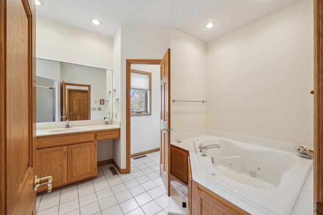 1181 12th Ave NW, New Brighton, MN 55112 - bathroom with a tub with jets, a shower stall, vanity, tile patterned floors, and recessed lighting