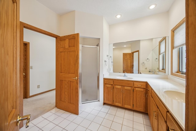 1181 12th Ave NW, New Brighton, MN 55112 - bathroom featuring a shower stall, double vanity, tile patterned floors, and recessed lighting