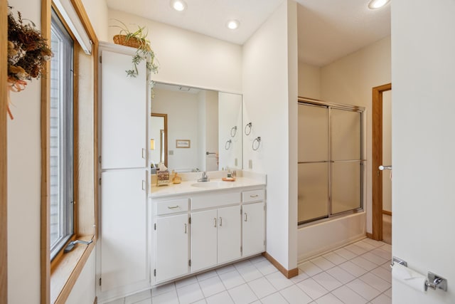 1181 12th Ave NW, New Brighton, MN 55112 - bathroom featuring vanity, bath / shower combo with glass door, tile patterned floors, recessed lighting, and plenty of natural light