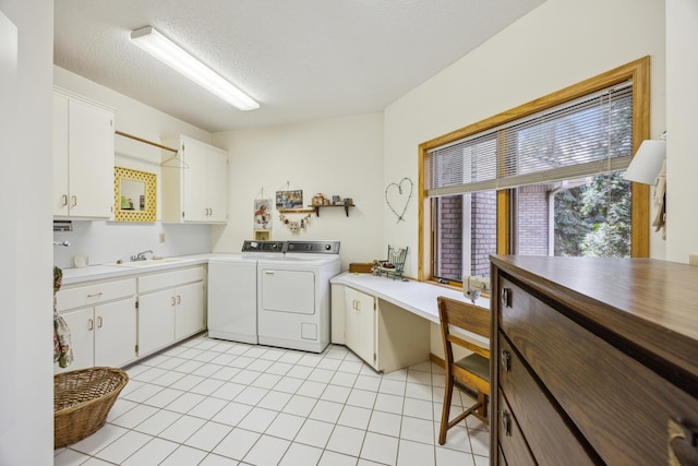 1181 12th Ave NW, New Brighton, MN 55112 - laundry room featuring cabinet space, washer and clothes dryer, light tile patterned floors, a textured ceiling, and a desk