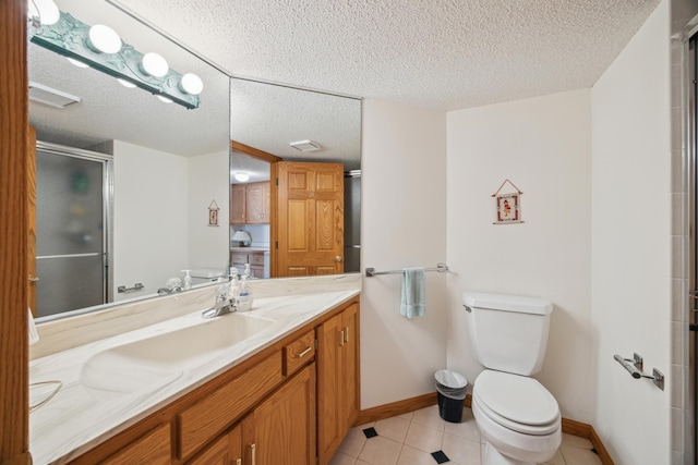 1181 12th Ave NW, New Brighton, MN 55112 - full bathroom with vanity, an enclosed shower, tile patterned floors, and a textured ceiling