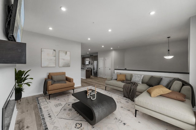 8698 London Cir NE Unit C, Blaine, MN 55449 - living room featuring light wood-style floors and recessed lighting