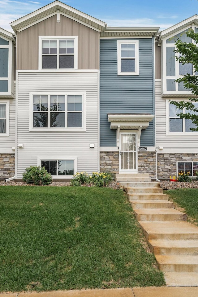 8698 London Cir NE Unit C, Blaine, MN 55449 - townhome / multi-family property featuring a front yard and stone siding