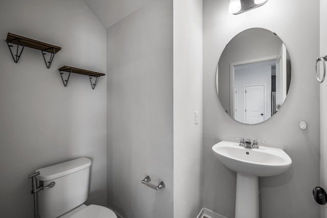 8698 London Cir NE Unit C, Blaine, MN 55449 - half bathroom featuring toilet and a sink