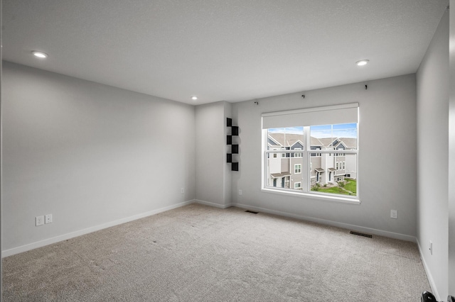 8698 London Cir NE Unit C, Blaine, MN 55449 - carpeted spare room with recessed lighting