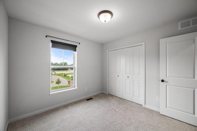 8698 London Cir NE Unit C, Blaine, MN 55449 - unfurnished bedroom with carpet flooring and a closet