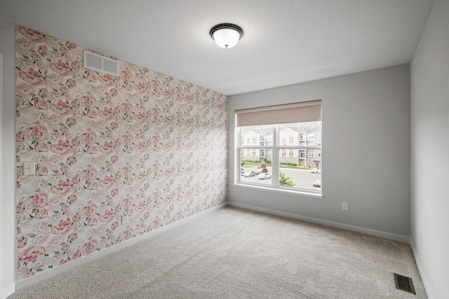 8698 London Cir NE Unit C, Blaine, MN 55449 - empty room featuring carpet and wallpapered walls