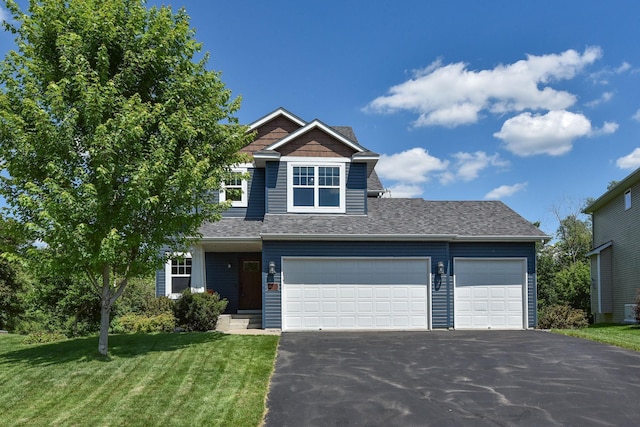 11608 21st St NE, Saint Michael, MN 55376 - view of front facade with driveway, a front lawn, roof with shingles, and an attached garage