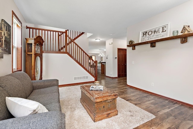 11608 21st St NE, Saint Michael, MN 55376 - living area with stairs, wood finished floors, and a chandelier