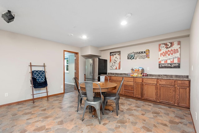 11608 21st St NE, Saint Michael, MN 55376 - dining space with light stone finish floors, recessed lighting, and bar