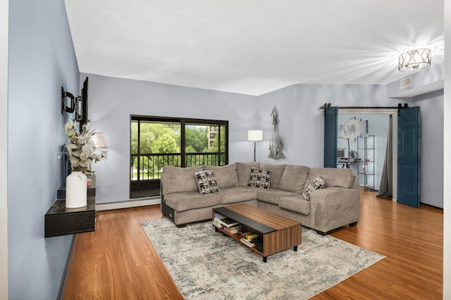 2265 Youngman Ave Unit 207E, Saint Paul, MN 55116 - living room featuring baseboard heating and wood finished floors