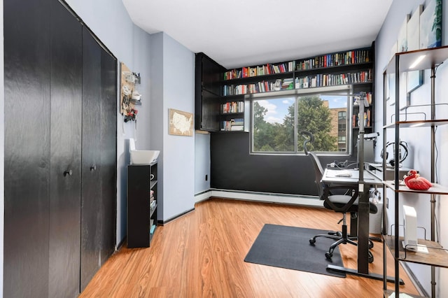 2265 Youngman Ave Unit 207E, Saint Paul, MN 55116 - office area featuring light wood-type flooring and a baseboard heating unit